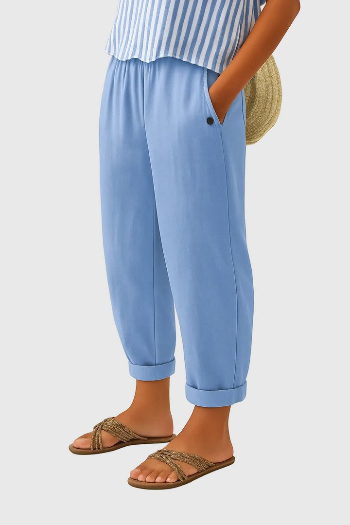 A woman wearing chic comfy trousers with a modern relaxed cut and flattering silhouette.