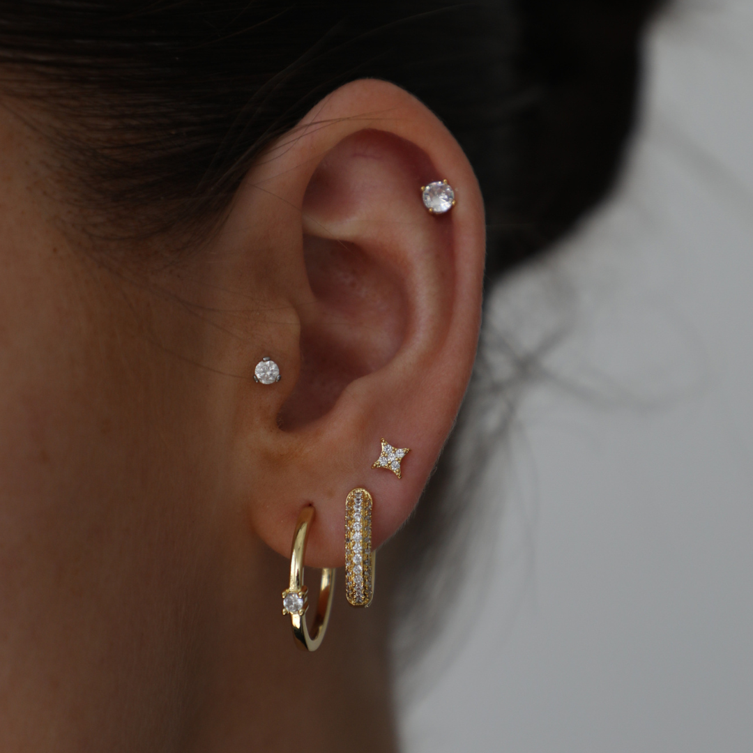 Delicate star-design side stud earrings in gold finish