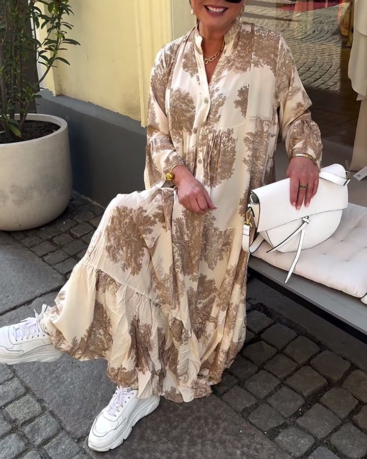 Woman wearing the Abigail flowing maxi dress with a delicate print and V-neckline, the skirt moving softly as she walks.