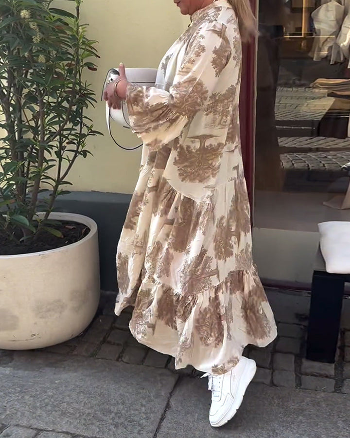 Woman wearing the Abigail flowing maxi dress with a delicate print and V-neckline, the skirt moving softly as she walks.