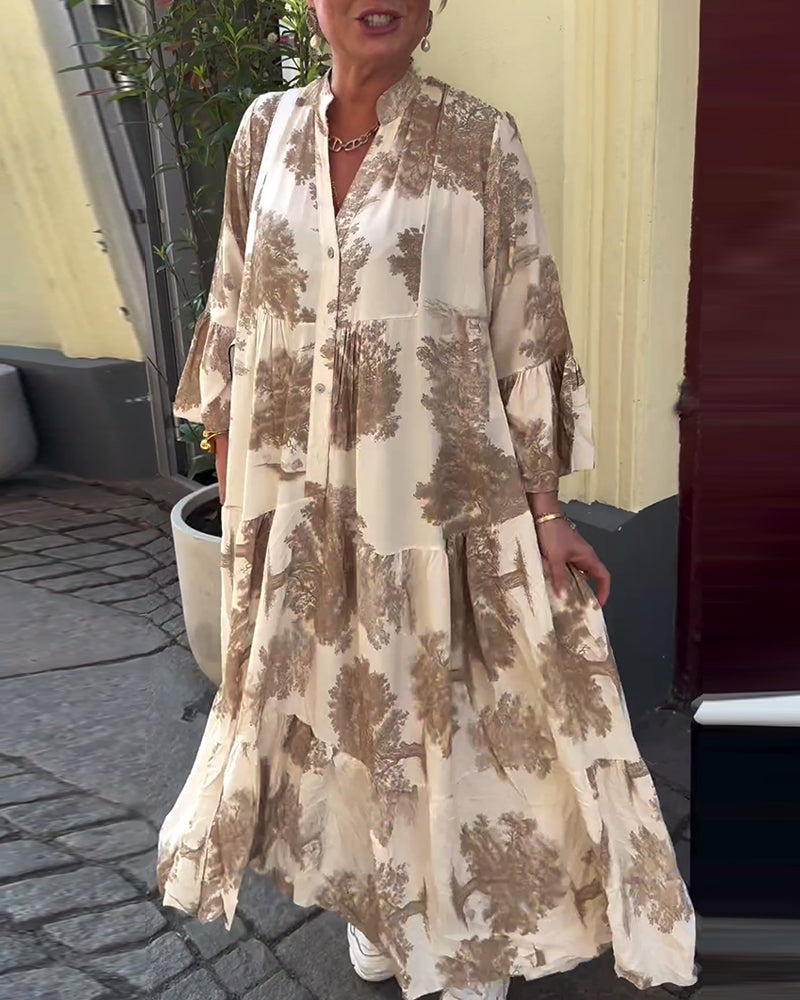 Woman wearing the Abigail flowing maxi dress with a delicate print and V-neckline, the skirt moving softly as she walks.