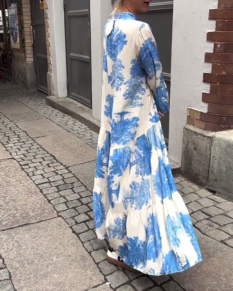 Woman wearing the Abigail flowing maxi dress with a delicate print and V-neckline, the skirt moving softly as she walks.