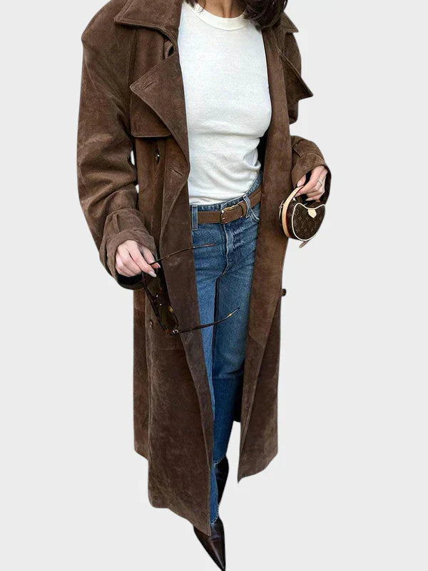 Classic belted trench coat in rich brown with a flowing, tailored silhouette and elegant collar