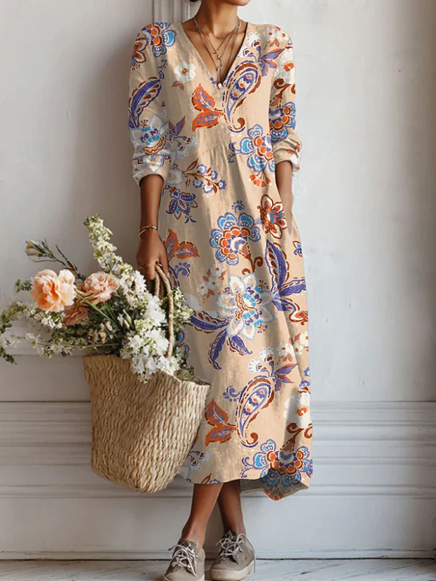 A woman wearing a soft, elegant everyday dress, relaxed and at ease going about her day.