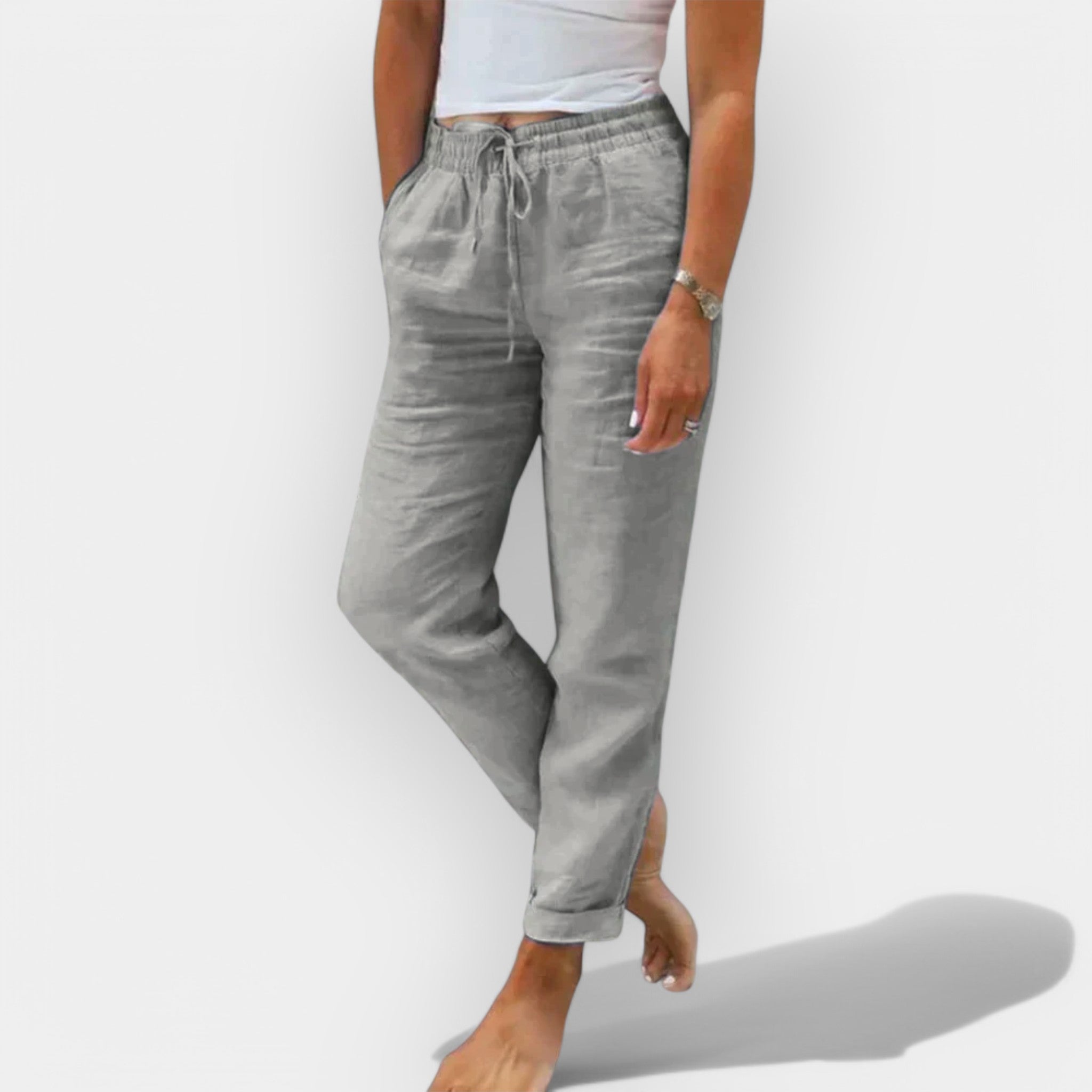 Light women's summer trousers in green with a wide, flowing leg silhouette