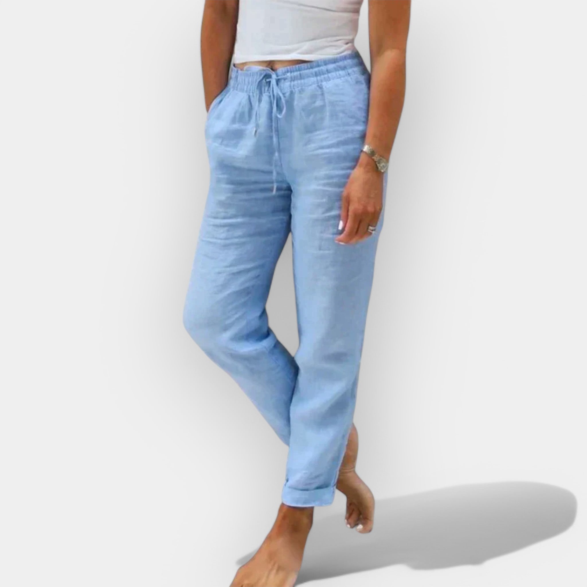 Light women's summer trousers in green with a wide, flowing leg silhouette
