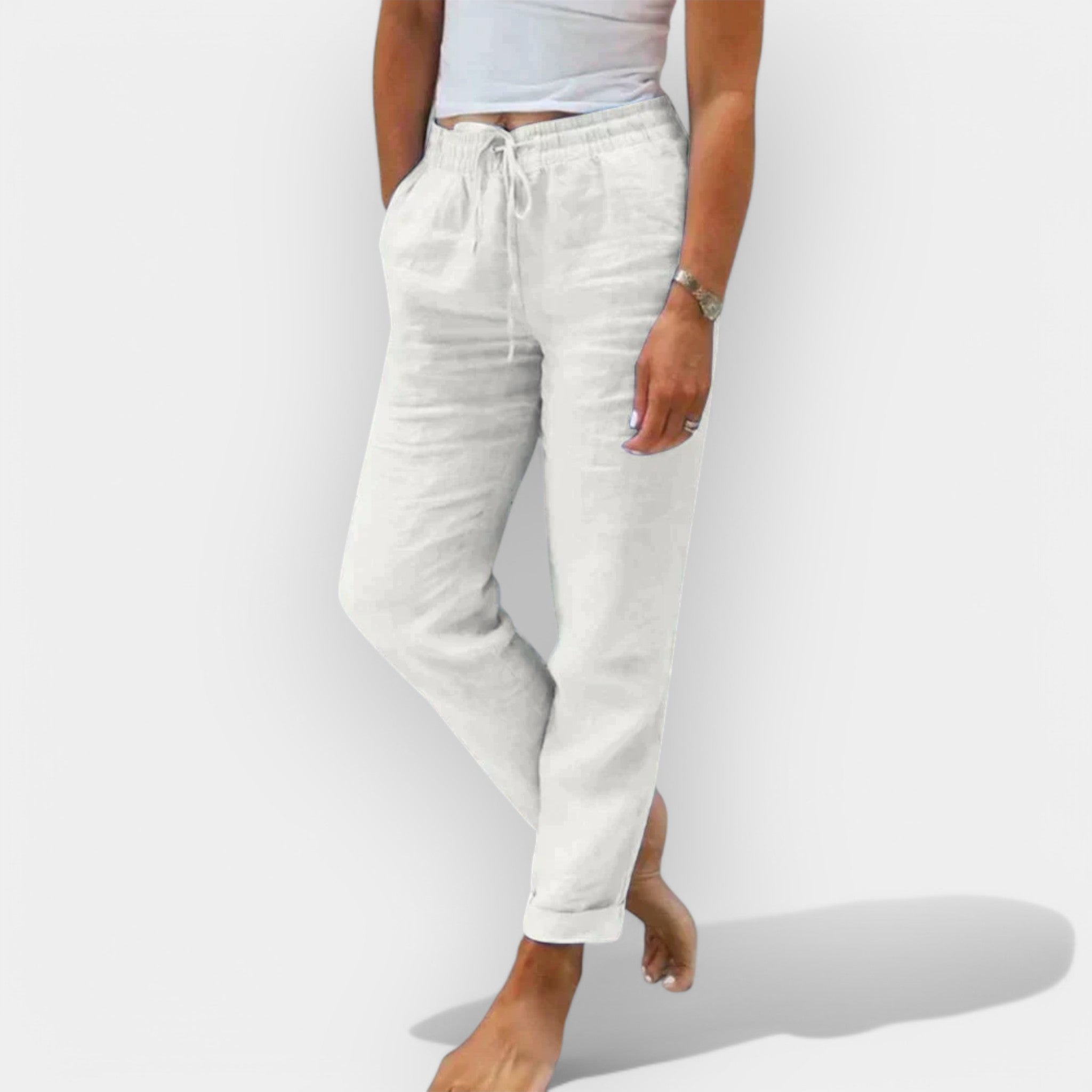 Light women's summer trousers in green with a wide, flowing leg silhouette