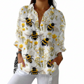 Multicolour women's blouse with golden bees on a floral background