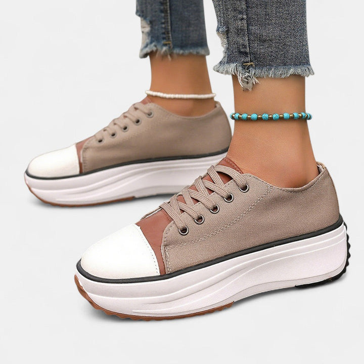 A woman in platform comfort trainers giving a flattering little lift.