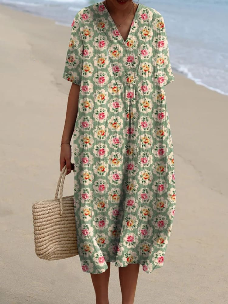 Relaxed floaty floral print dress with a soft tie detail at the back, shown in a variety of vibrant and neutral prints