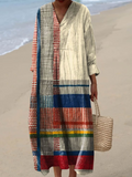 A sleeveless retro-style patchwork stripe dress in vibrant electric blue, pink, green and purple
