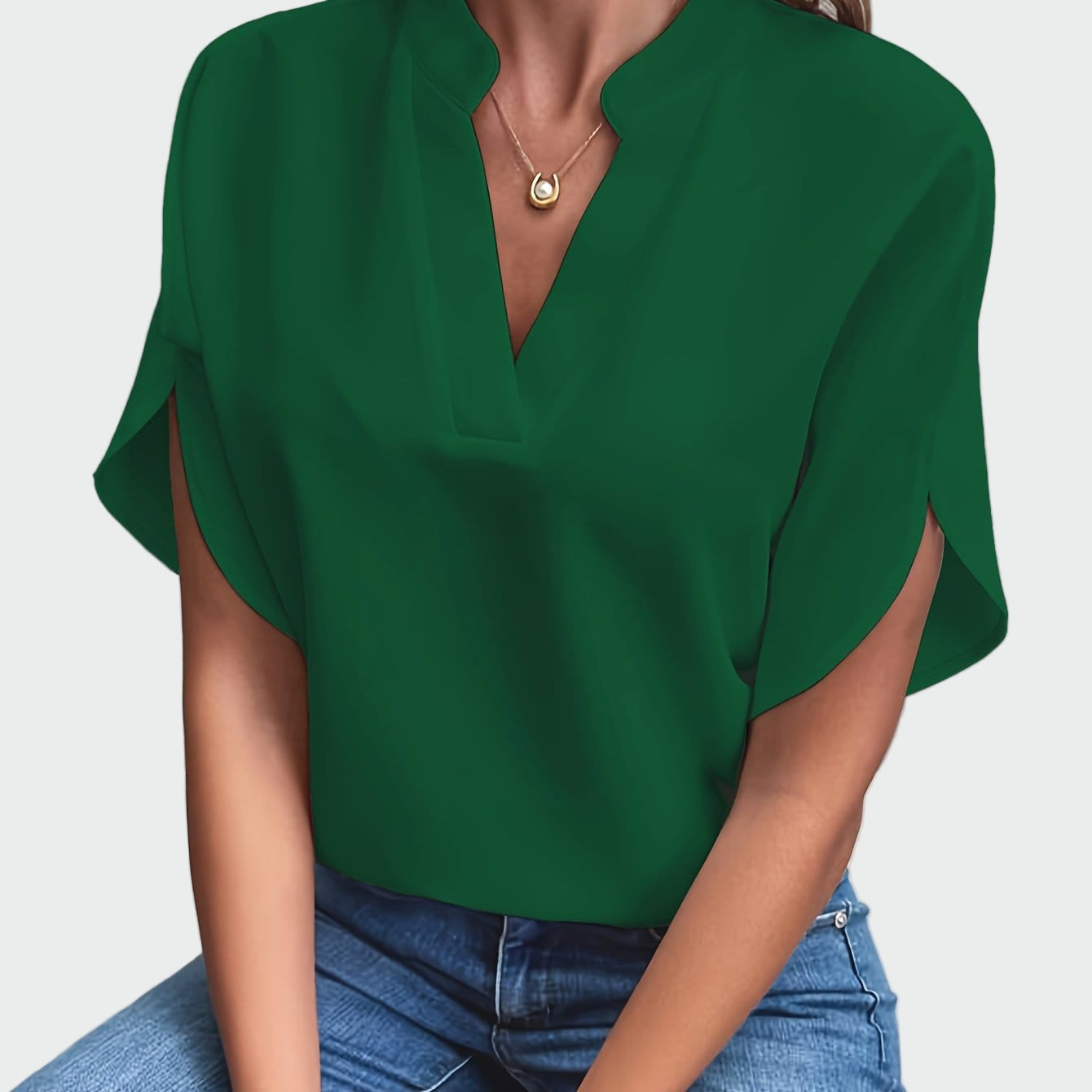 White V-neck blouse with a draped minimalist design and short sleeves with side openings