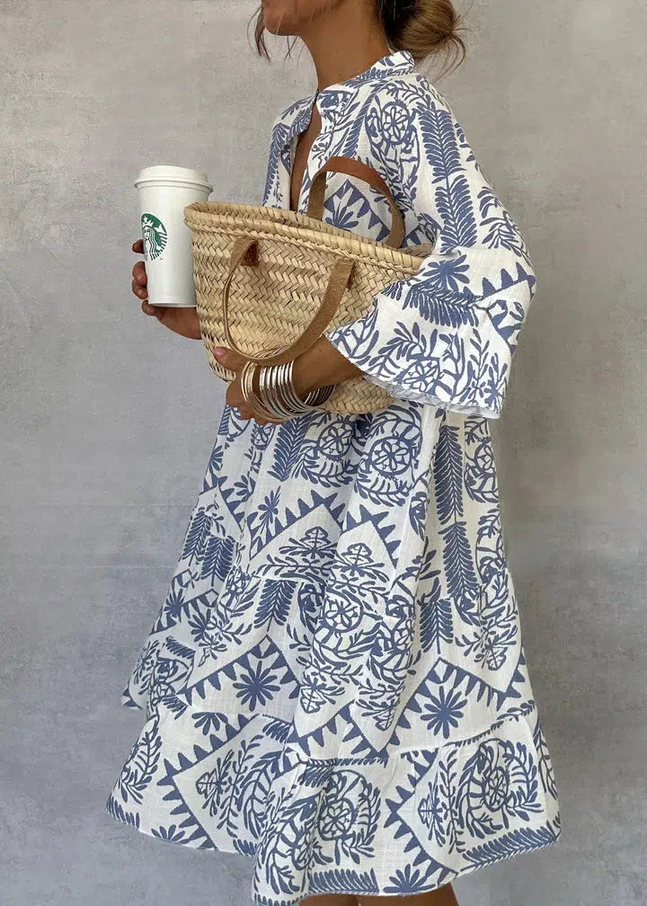 Woman wearing the Vivienne button-front boho tunic dress, relaxed on a casual day out.