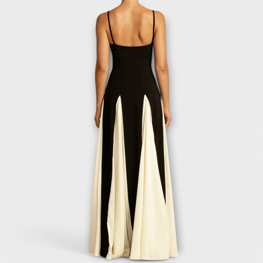 A classic black versatile midi dress styled simply for everyday elegance