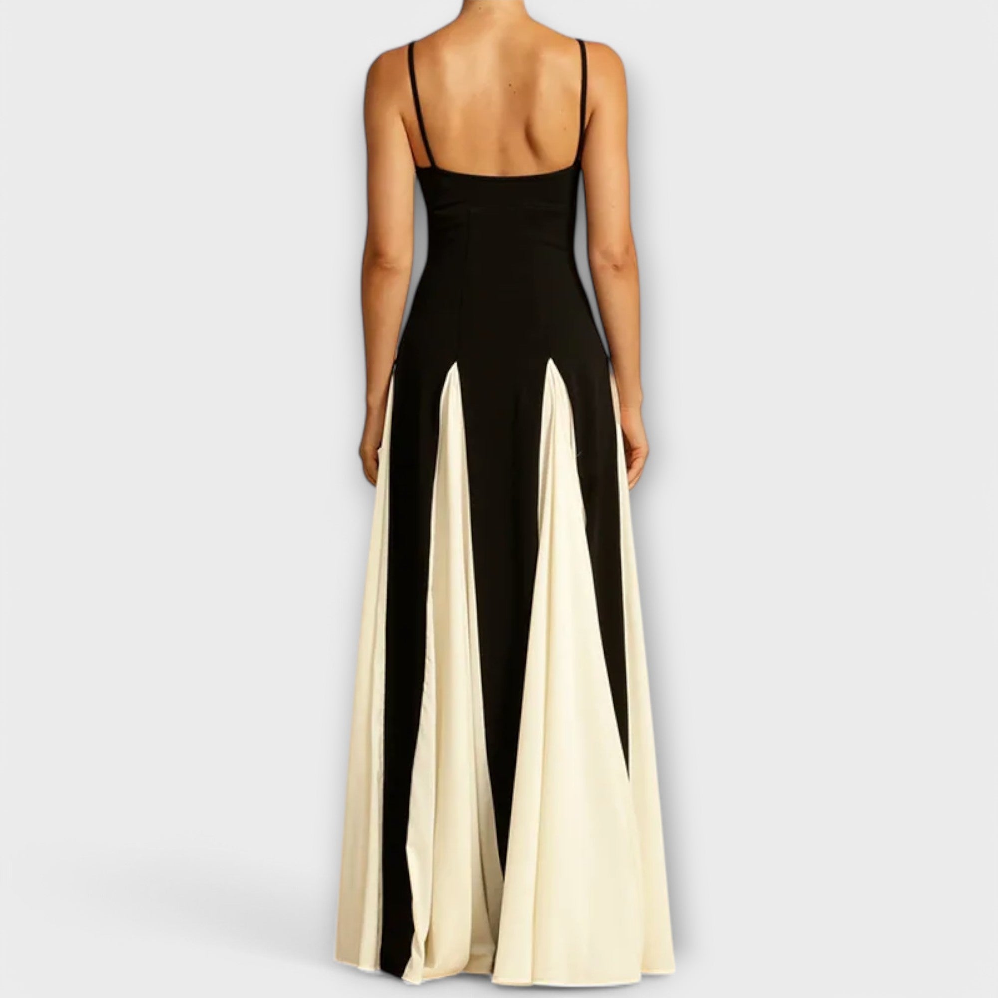 A classic black versatile midi dress styled simply for everyday elegance