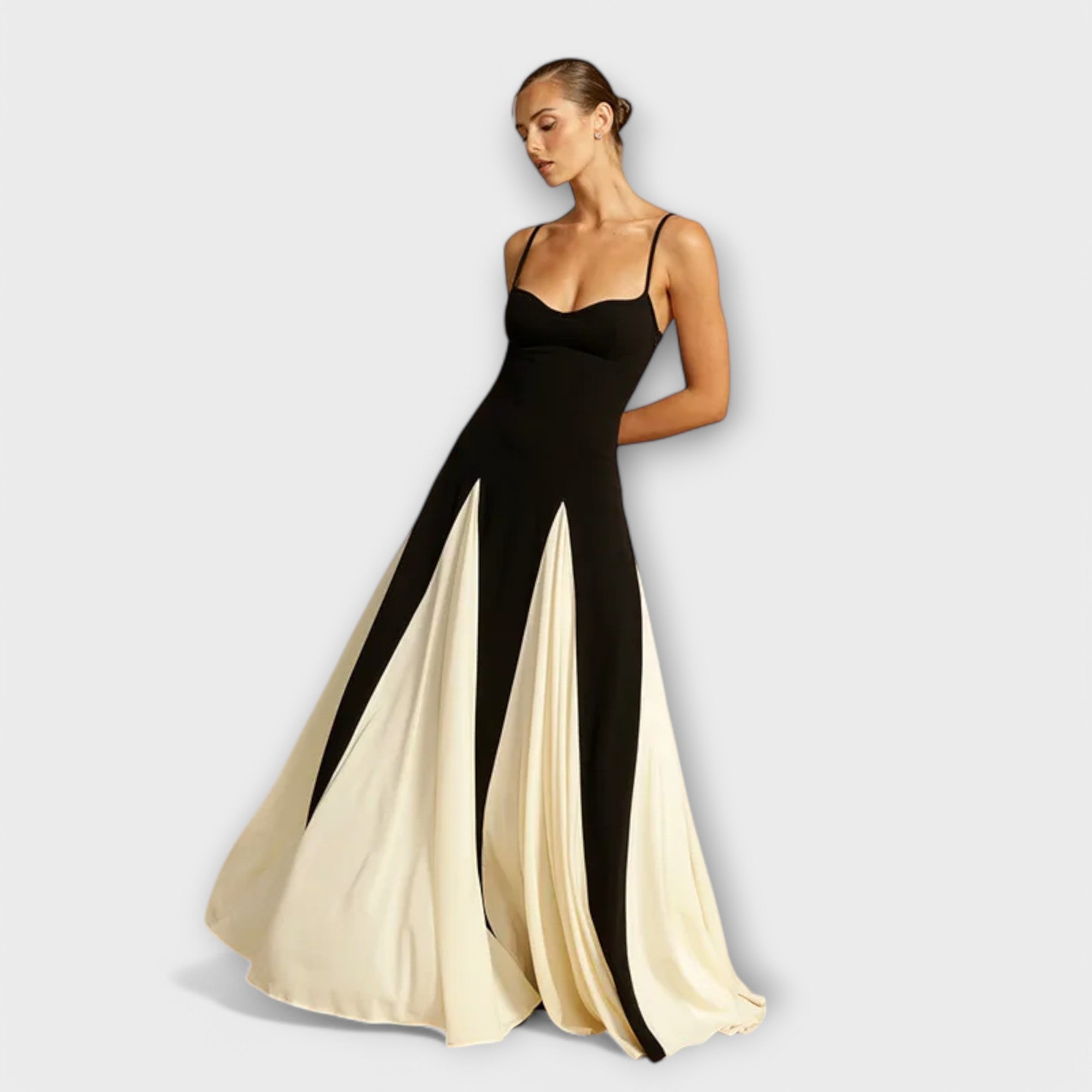 A classic black versatile midi dress styled simply for everyday elegance