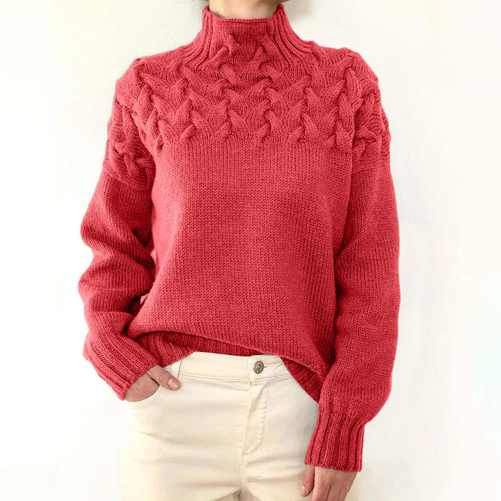 A woman wearing a warm roll-neck jumper, cosy and elegant on a cold winter day.