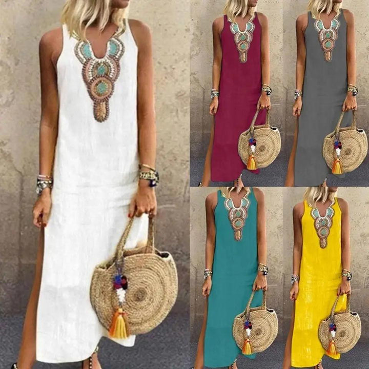 Woman in a sleeveless midi dress with embroidered neckline strolling in the summer sun.