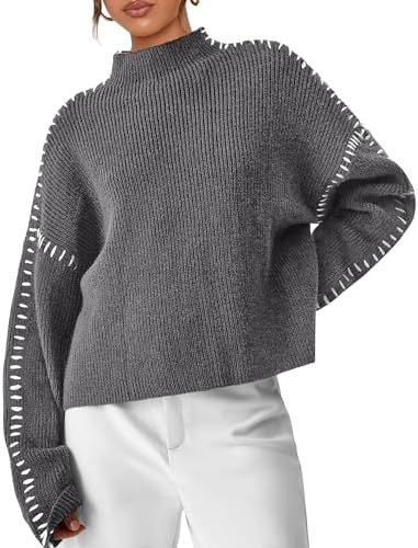 A woman wearing an oversized mock-neck jumper with whipstitch detailing, cosy and stylish.