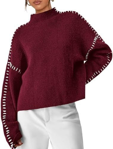 A woman wearing an oversized mock-neck jumper with whipstitch detailing, cosy and stylish.