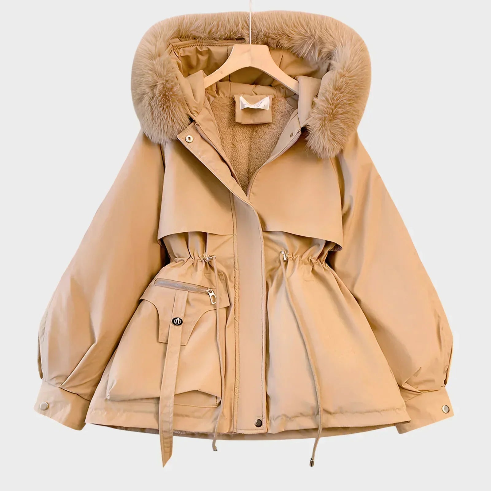 An elegant structured winter coat in camel, styled over a layered winter outfit