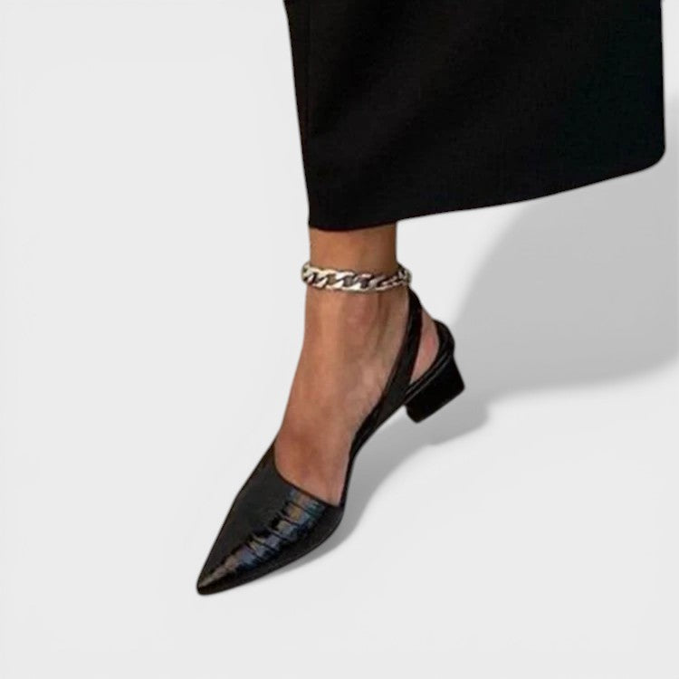 Women's pointed-toe slingback heels in dark brown with an adjustable back strap and elegant silhouette