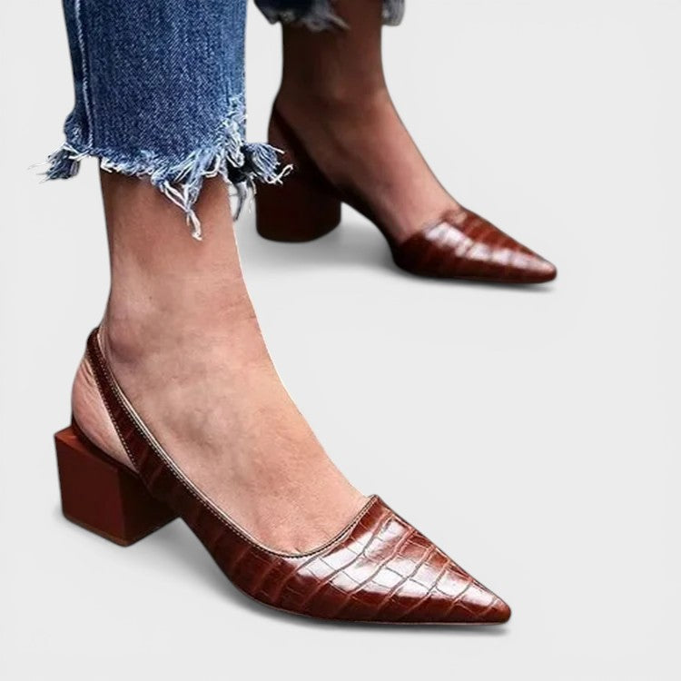Women's pointed-toe slingback heels in dark brown with an adjustable back strap and elegant silhouette