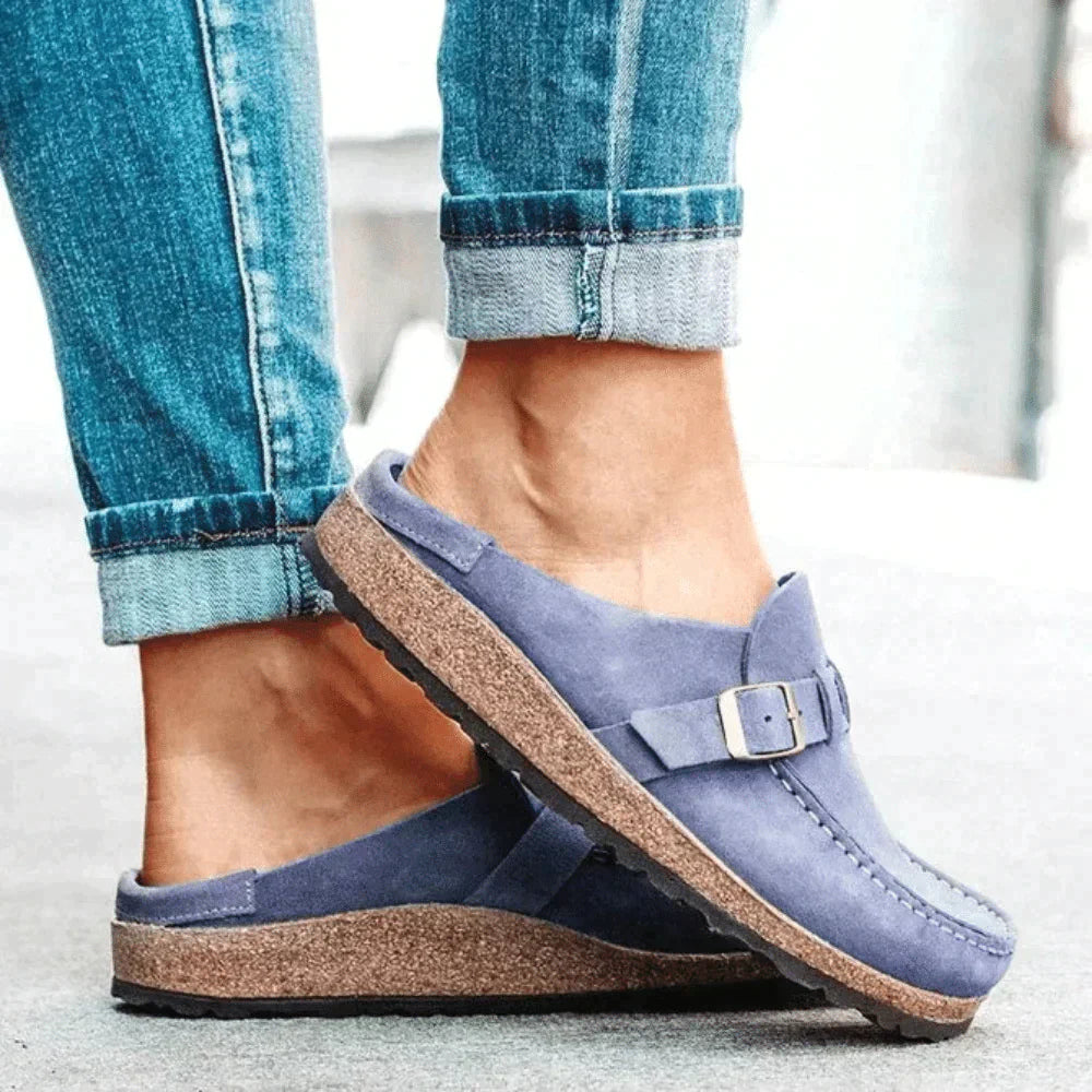 Taupe backless clogs with closed toe and adjustable buckle strap