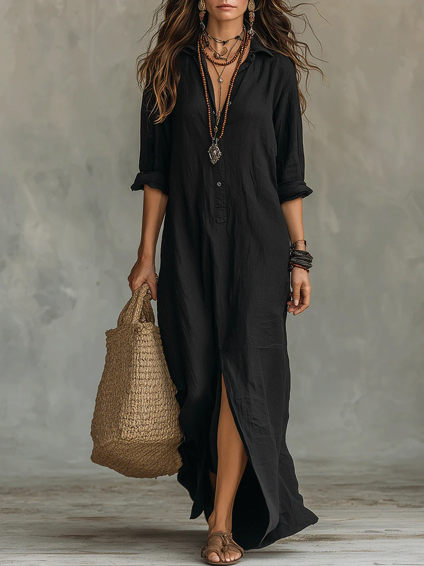 Elegant floaty maxi dress in black with a flowing full-length silhouette and structured bodice