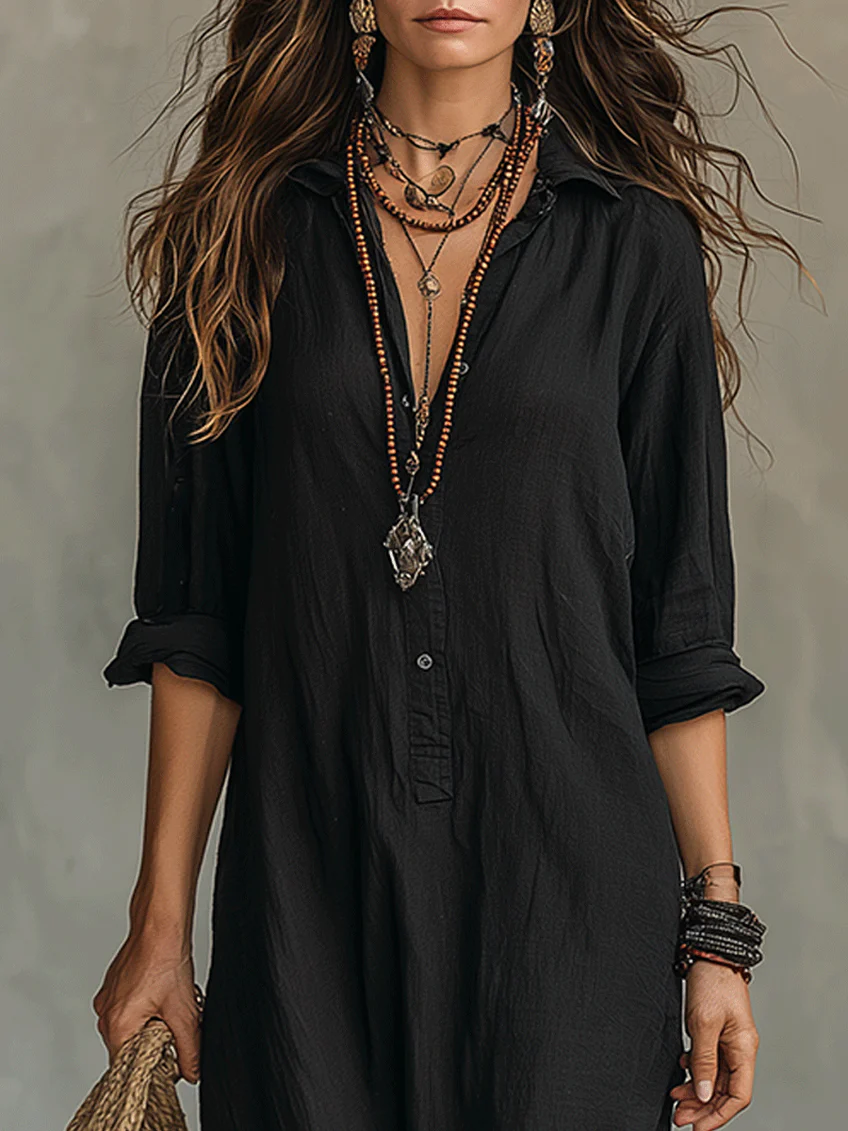 Elegant floaty maxi dress in black with a flowing full-length silhouette and structured bodice