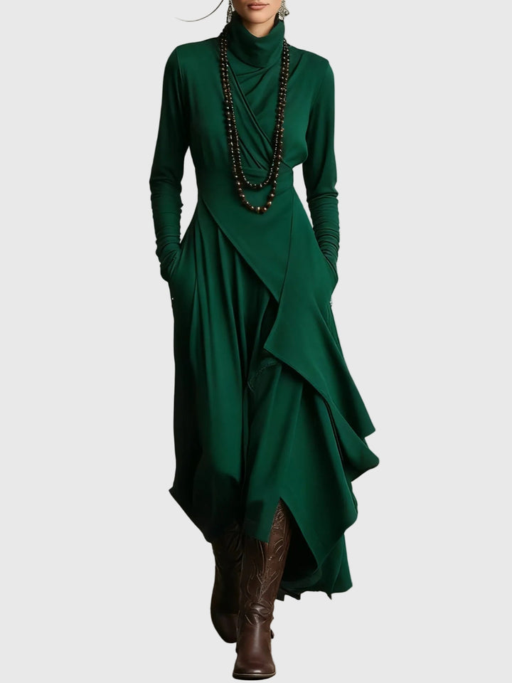 Woman wearing the Lucy draped high-neck maxi dress in violet with ankle boots.