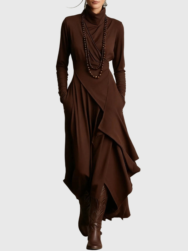 Woman wearing the Lucy draped high-neck maxi dress in violet with ankle boots.