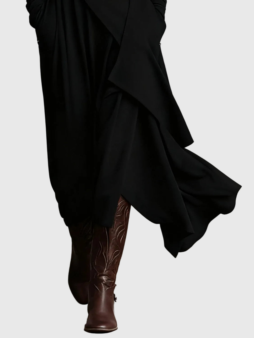 Woman wearing the Lucy draped high-neck maxi dress in violet with ankle boots.