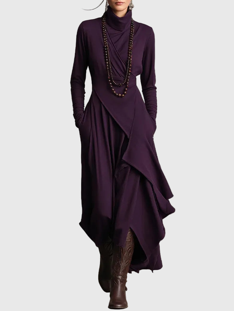 Woman wearing the Lucy draped high-neck maxi dress in violet with ankle boots.