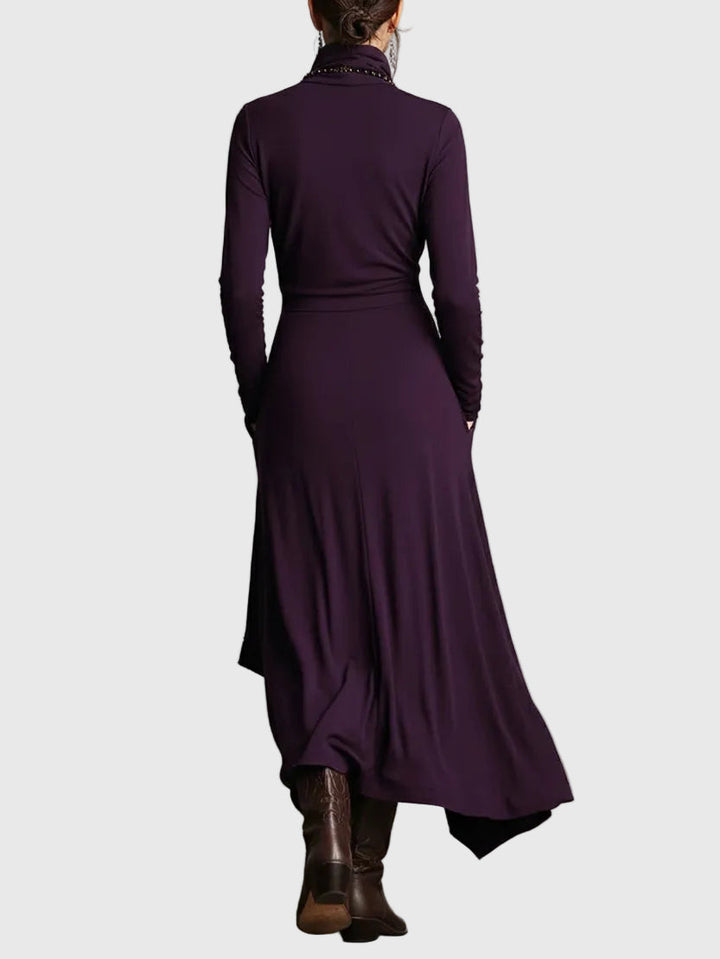 Woman wearing the Lucy draped high-neck maxi dress in violet with ankle boots.