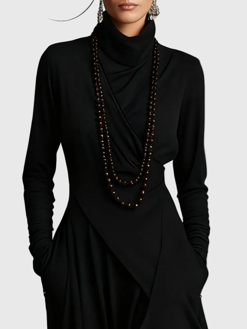 Woman wearing the Lucy draped high-neck maxi dress in violet with ankle boots.