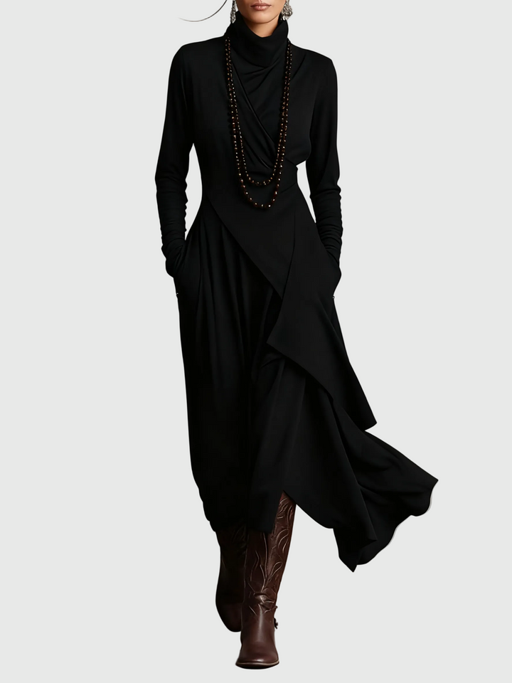 Woman wearing the Lucy draped high-neck maxi dress in violet with ankle boots.