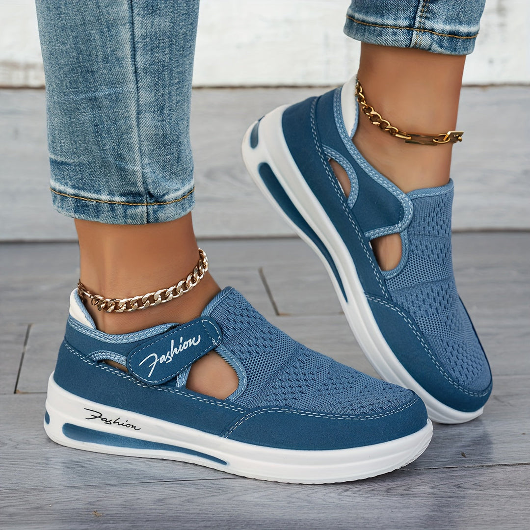 A woman slipping on breathable, cushioned slip-on trainers with trousers