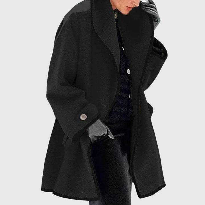 A woman wearing a double-breasted buttoned jacket on a cold day
