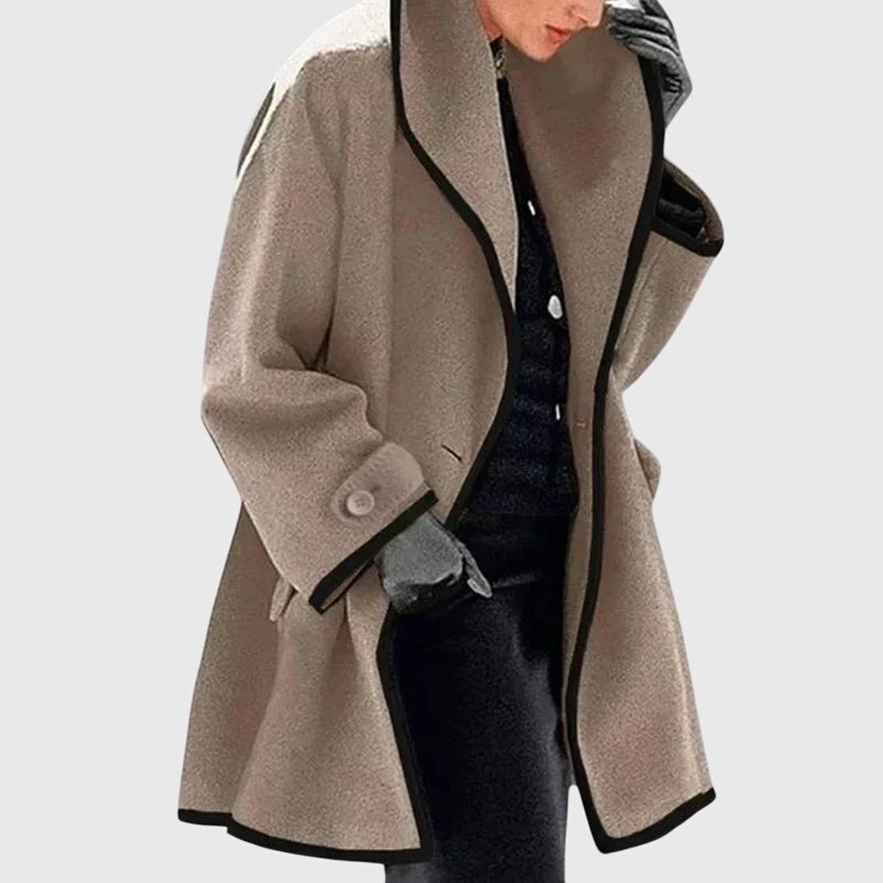 A woman wearing a double-breasted buttoned jacket on a cold day