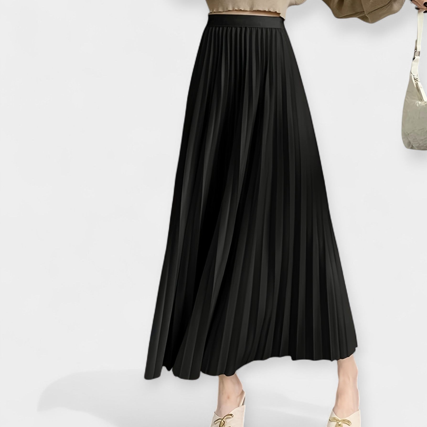 Wide pleated high-waist midi skirt in soft blush pink with a flowing silhouette