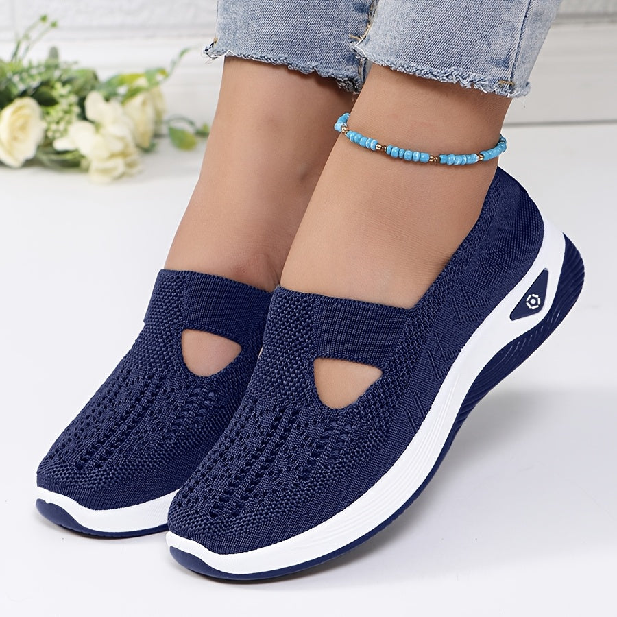 A woman stepping into easy slip-on comfort trainers with no laces.