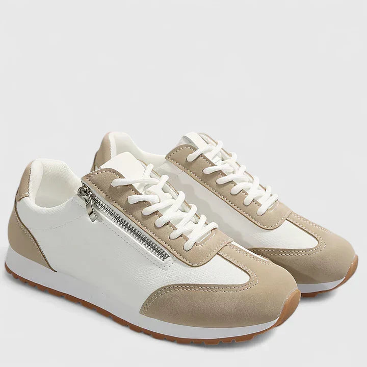 A woman wearing orthopaedic shoes with a supportive heel and a subtle lift
