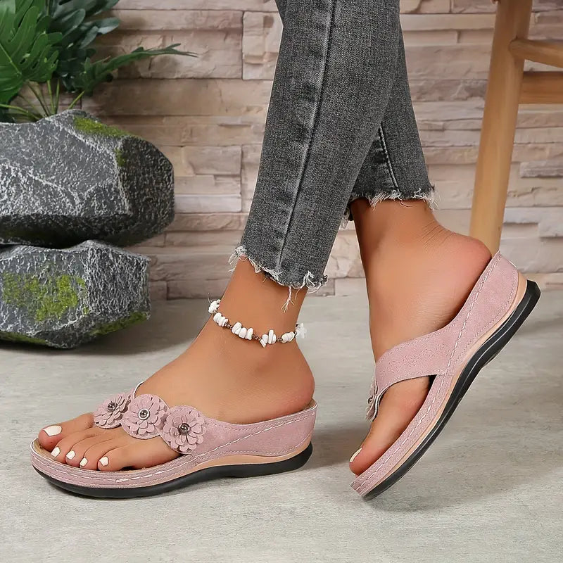 Women's floral toe-post sandals with a soft cushioned base in dark brown, black, navy, red and rose
