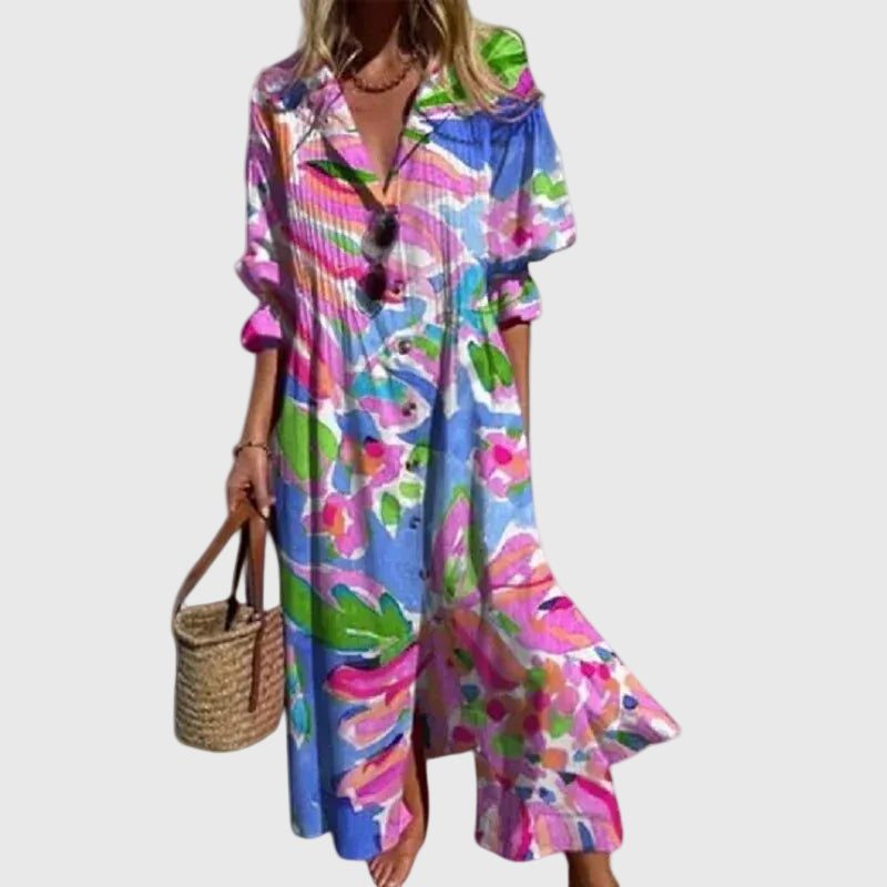 Woman in a long flowing boho-style maxi dress with delicate patterns, walking outdoors.