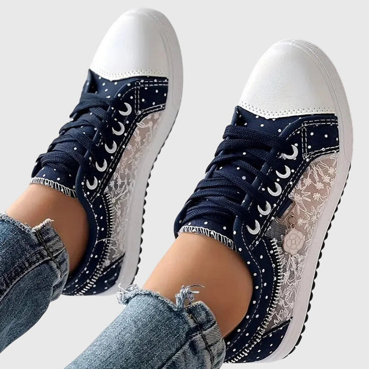 A woman walking comfortably in blue cushioned orthopaedic trainers