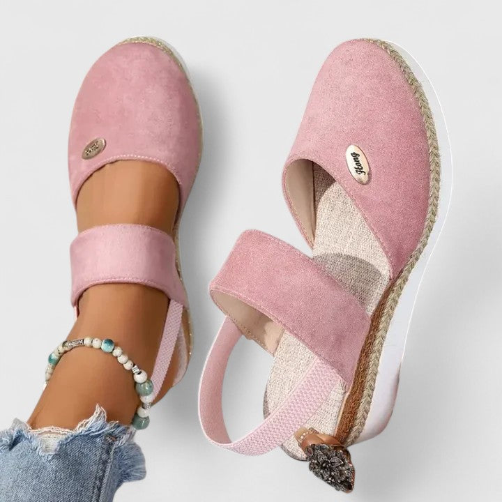 A woman in beige espadrille-inspired sandals stepping out comfortably on a bright morning.