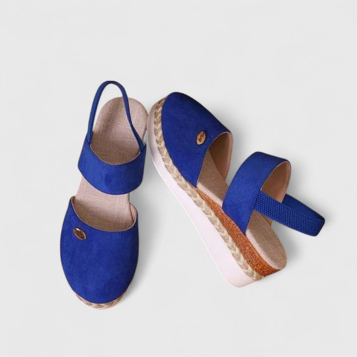 A woman in beige espadrille-inspired sandals stepping out comfortably on a bright morning.