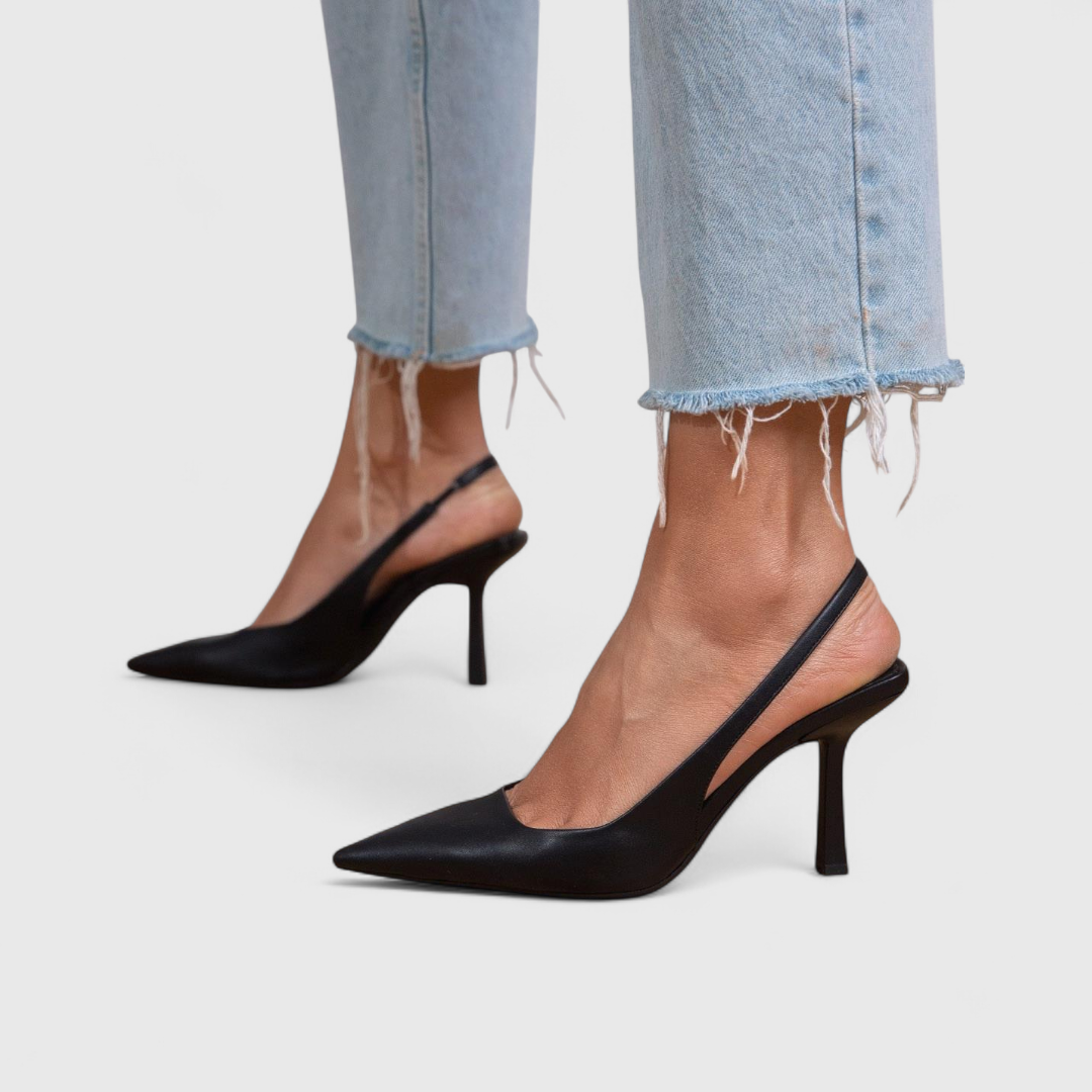 Pointed toe slingback heels in beige and black with a slender, minimalist heel