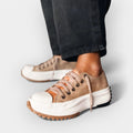 Women's thick-sole comfort trainers in warm brown tones with a chunky ergonomic sole